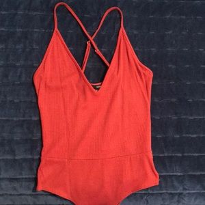 Burnt orange body suit